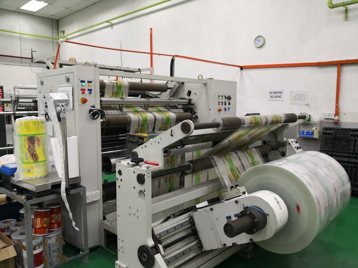 Slitting machine winding printed film into finished rolls